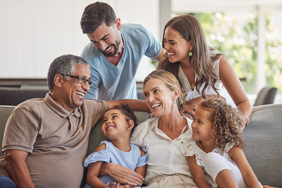 multigenerational family happy on sofa