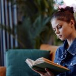 Young women reads the best financial literacy books