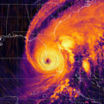 Hurricane Ian - colorful satellite weather map overlayed with wind streams.