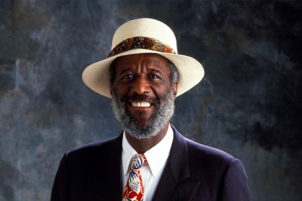 headshot of wally amos with gray backdrop