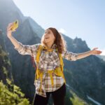 woman taking a selfie while on a mountain