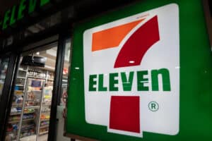 front of a 7-Eleven store at night