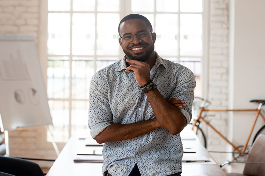 African American man smiling at camera in an office