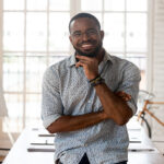 African American man smiling at camera in an office