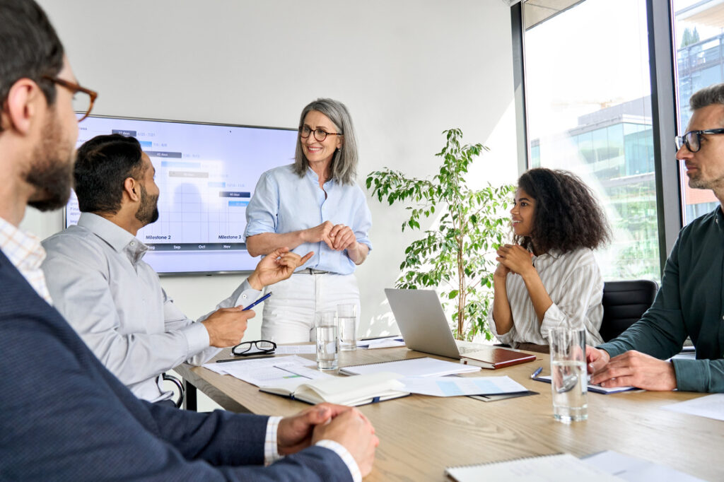 Business leader and employees having a meeting at the office