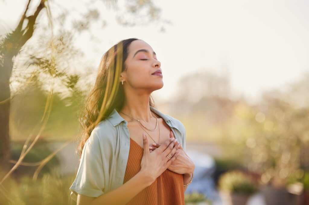 woman meditating outside