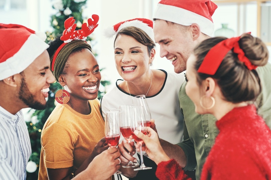 A group of co-workers celebrating Christmas in the workplace