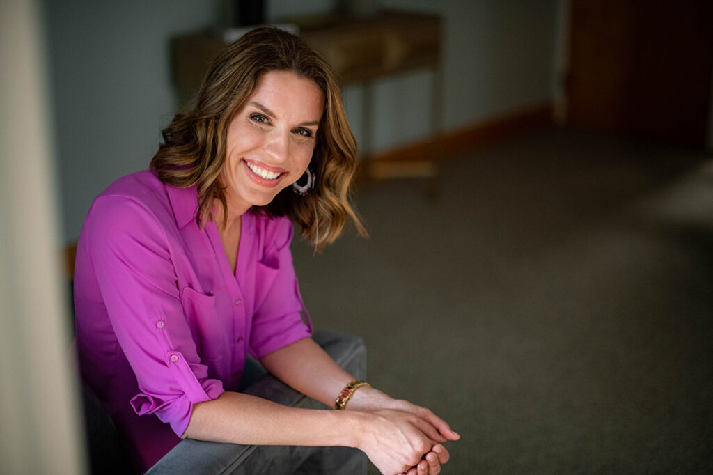 Erica Anderson Rooney headshot in pink blouse