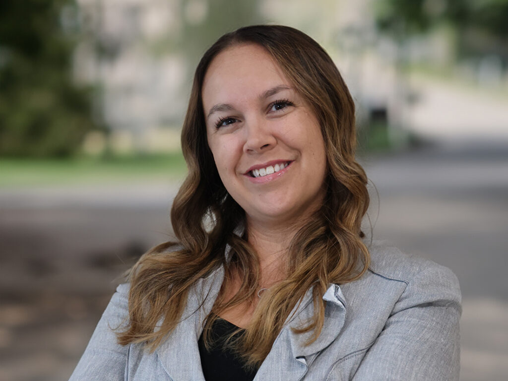 Headshot of Amanda Webster in a grey suit jacket