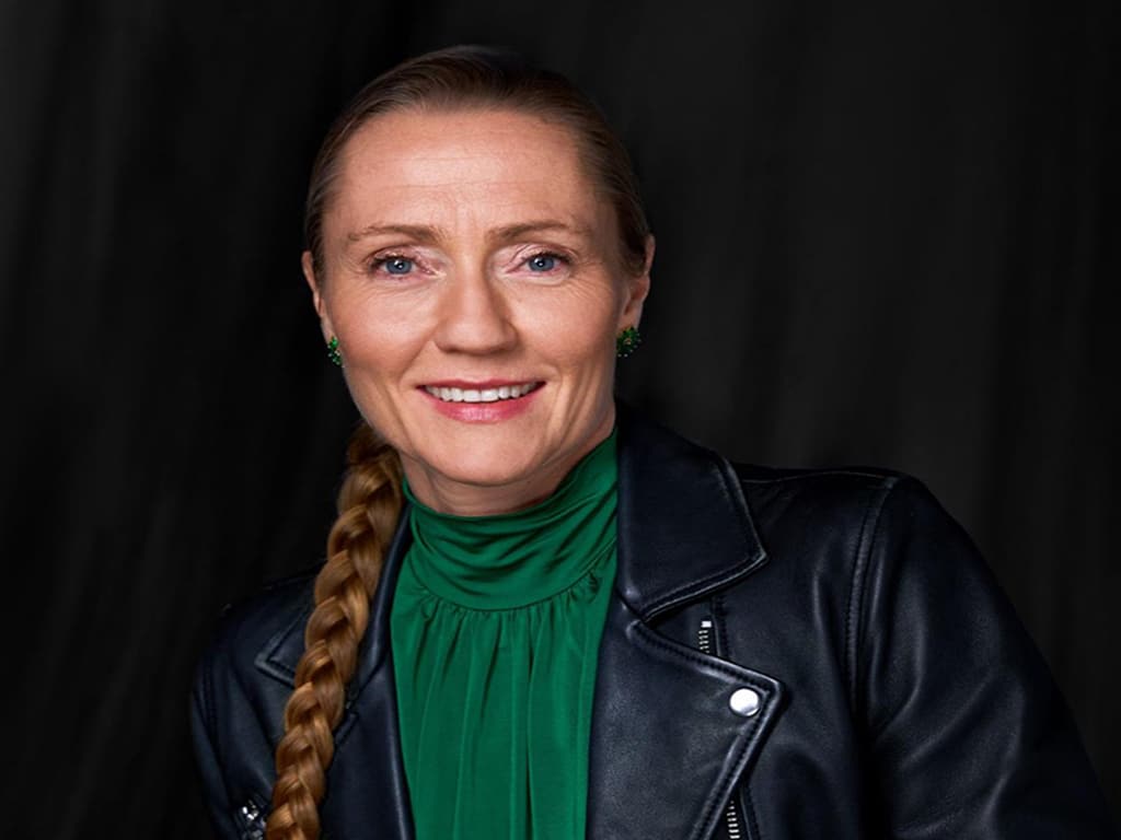 Portrait of Elin Hauge in green shirt and black leather jacket