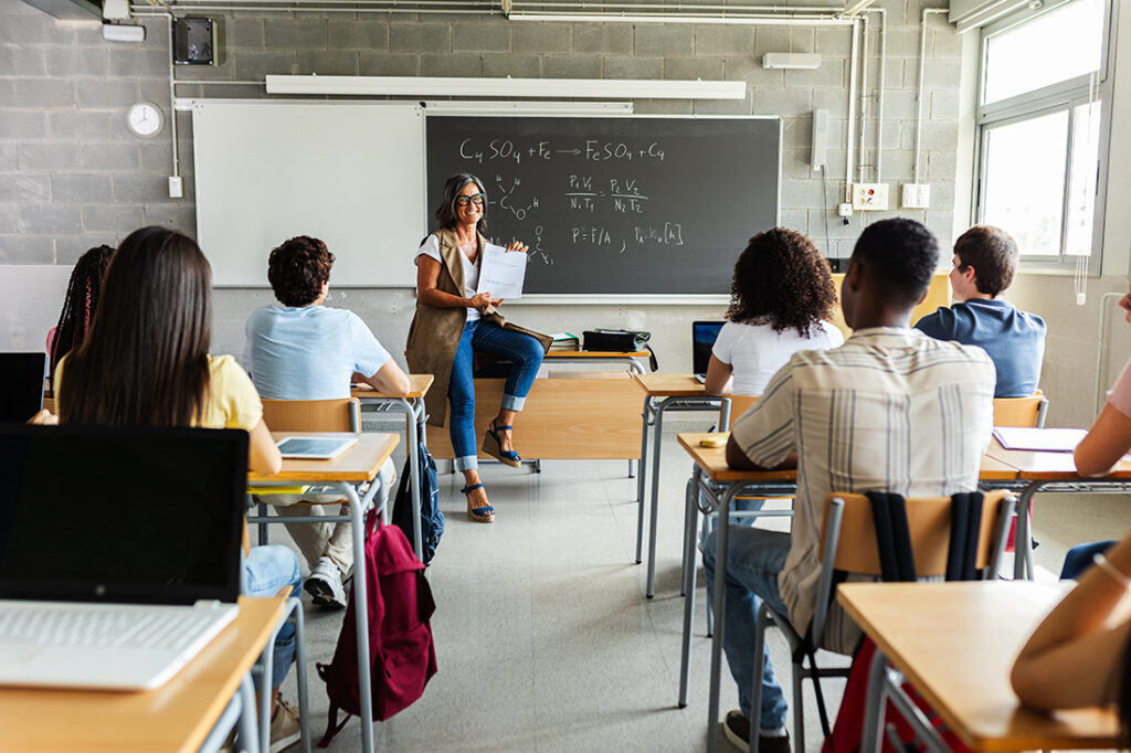 Teacher with group of students in a classroom