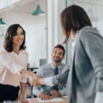 business women shaking hands showing how to negotiate salary