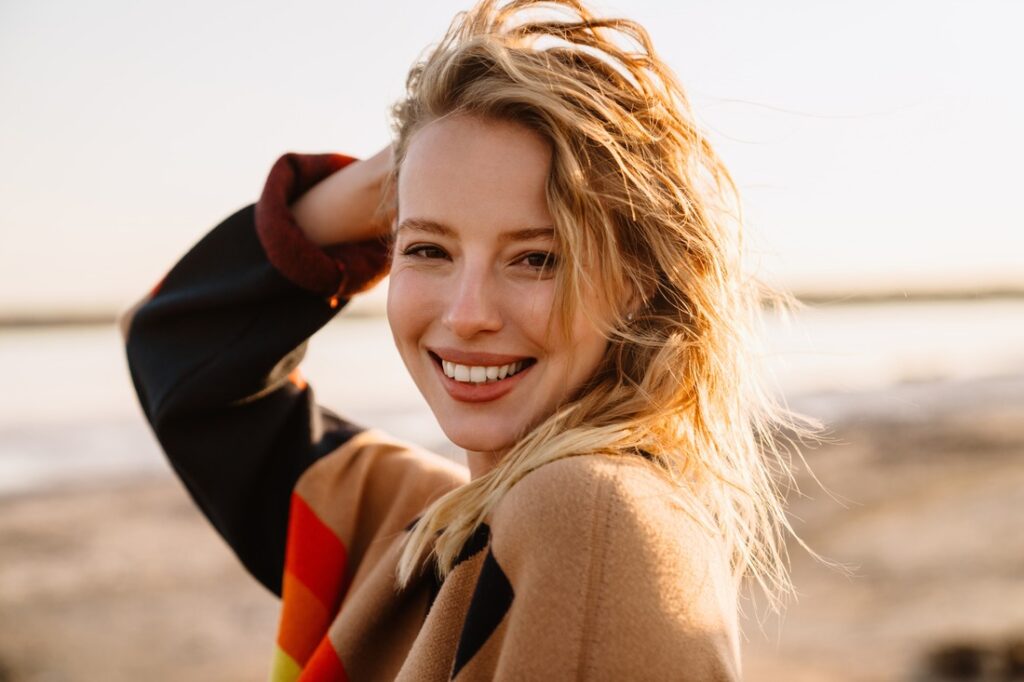 woman smiling at the beach