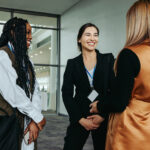 Three women shaking hands