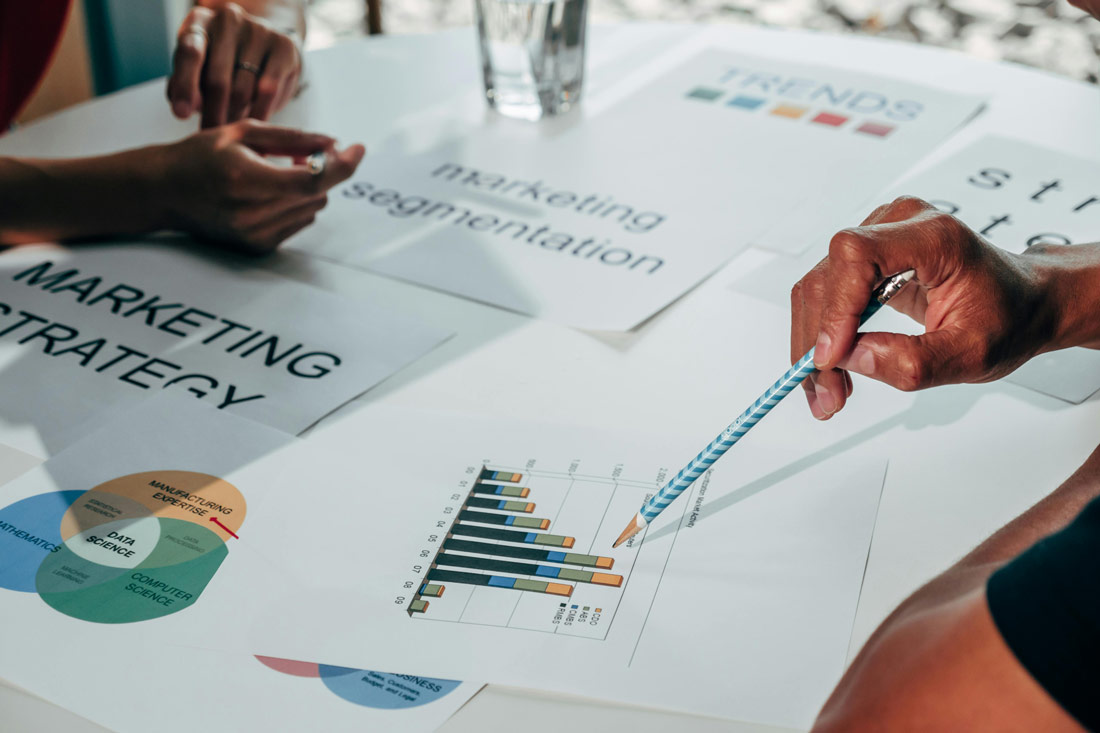 two business men looking over performance statistics