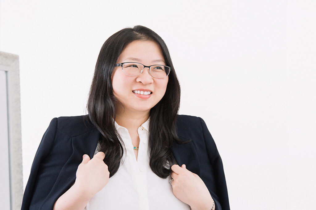 Mandy Tang in a white shirt and black blazer