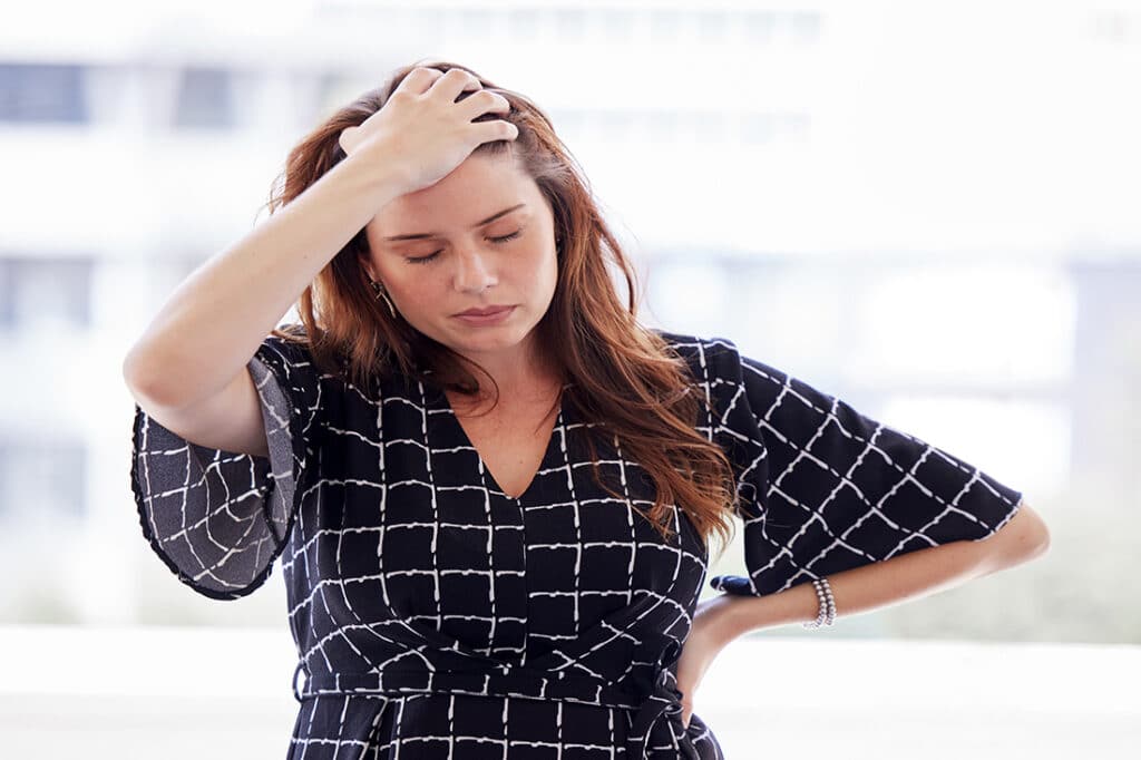 Stressed out woman grabbing her head