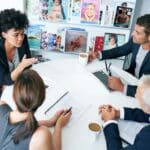 a group meeting of magazine staff discussing The Future of Editorial Jobs