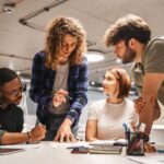 a group of young entrepreneurs learning how to start a new business