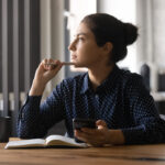 young women remote worker wondering how to stay motivated working from home