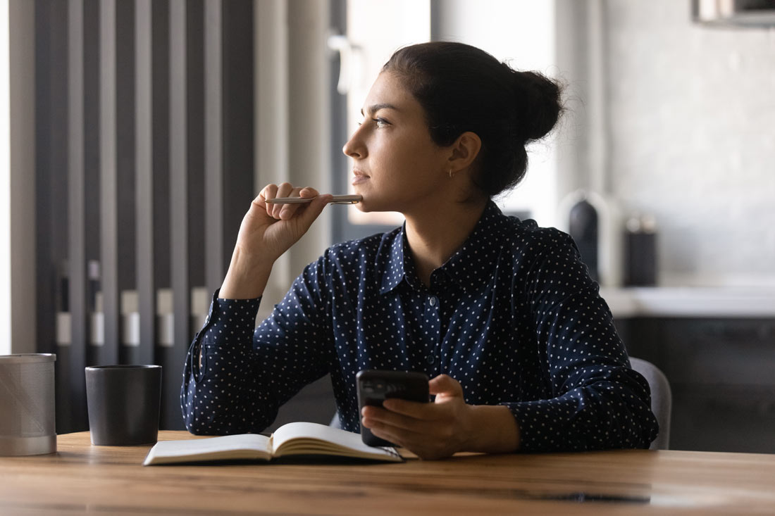 young women remote worker wondering how to stay motivated working from home