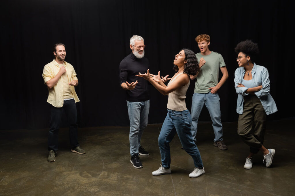 A group of actors improvising on a stage