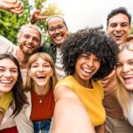 a group of multicultural friends taking a selfie