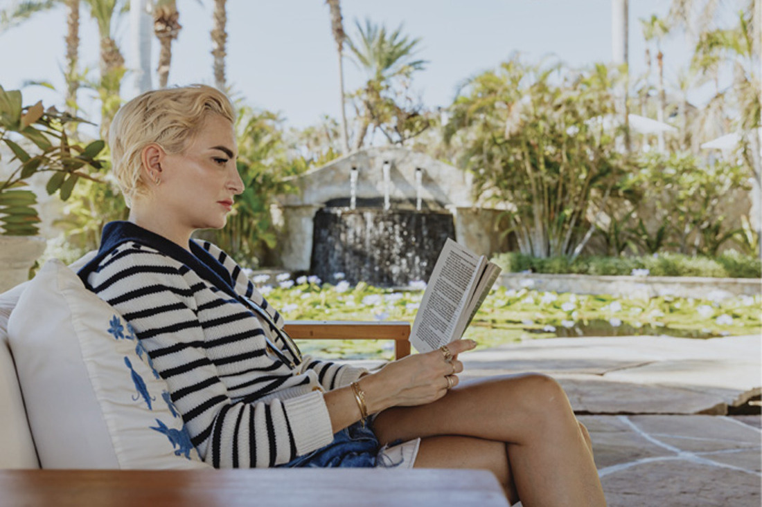 Anne M. Appel, M.A. reading a book