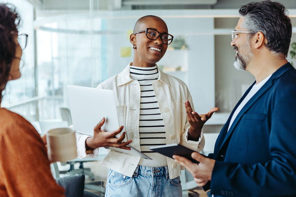 Business woman exchanging ideas and communicating effectively with her colleagues