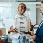 Business woman exchanging ideas and communicating effectively with her colleagues