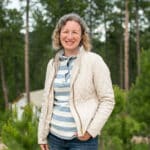 sarah dusek standing with trees in backdrop