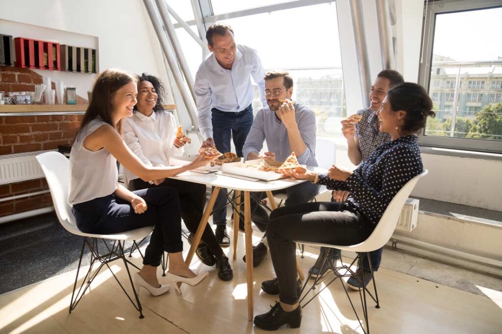 happy team having a work lunch together