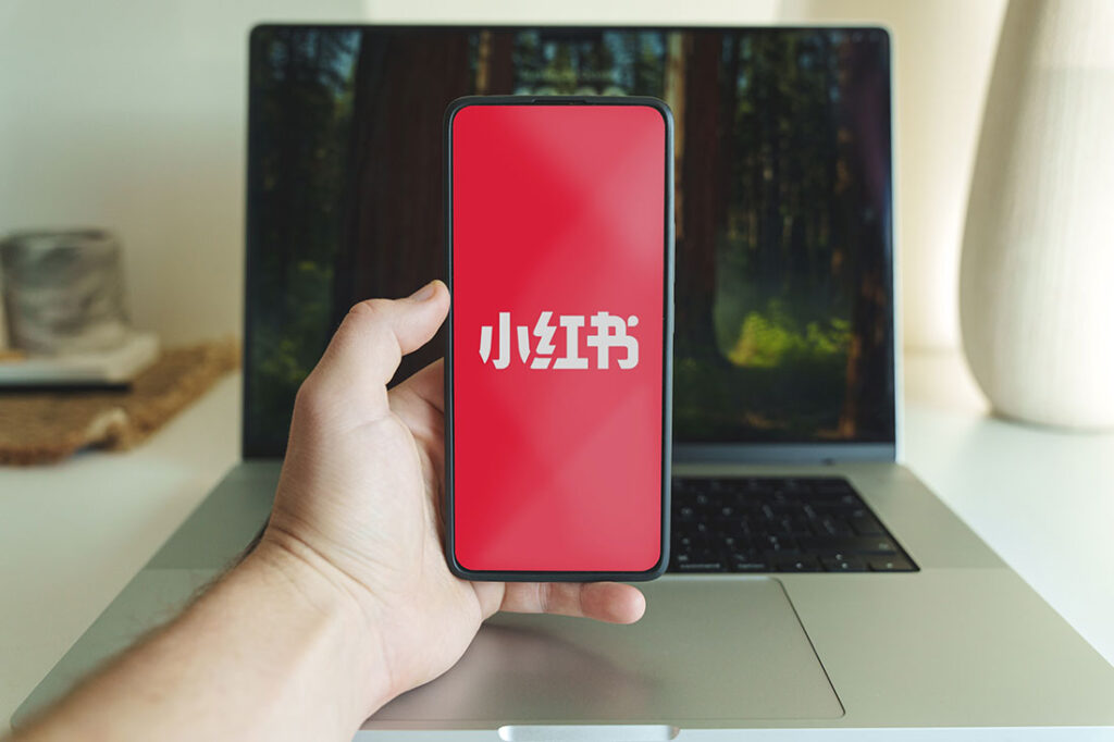 REDnote app on smartphone screen, Chinese social media