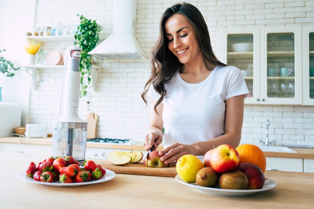 Woman cutting fruit