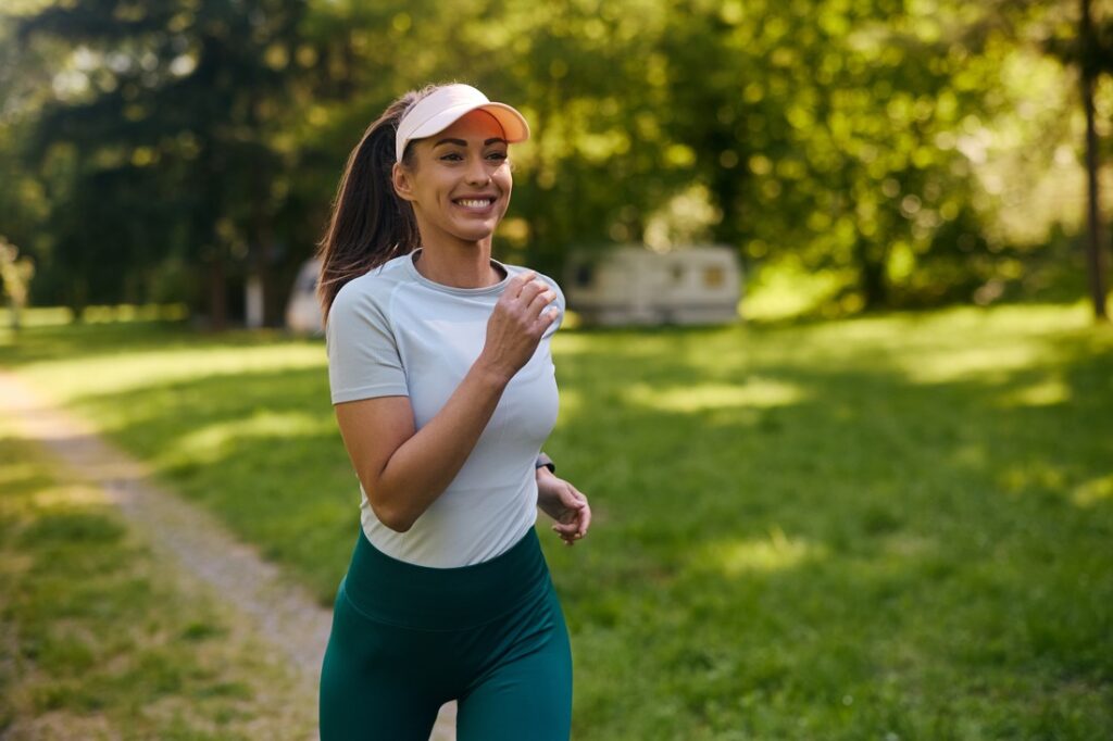 a woman running in a park