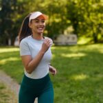 a woman running in a park