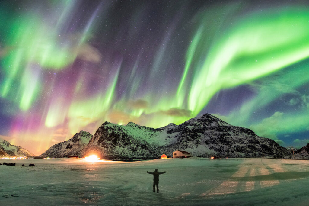 a person viewing the aurora borealis (northern lights) in Norway