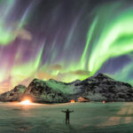 a person viewing the aurora borealis (northern lights) in Norway