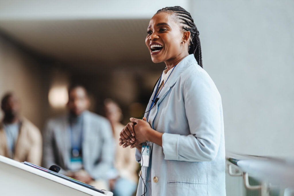 Woman public speaking and smiling