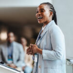 Woman public speaking and smiling