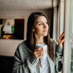 Young woman spending free time alone at home