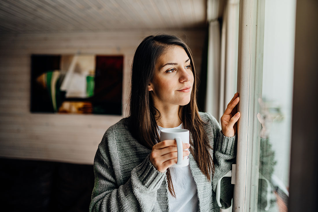 Young woman spending free time alone at home