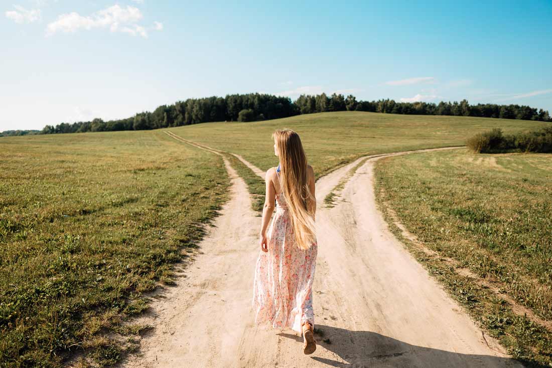 a woman approaches a fork in the road using tips for career change