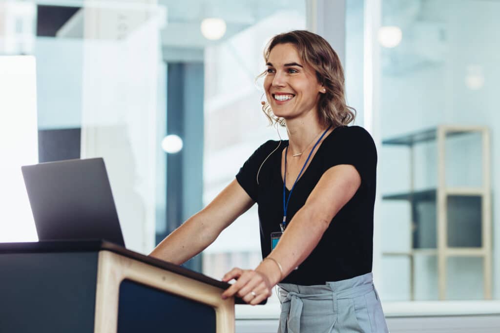 Woman public speaking at a podium