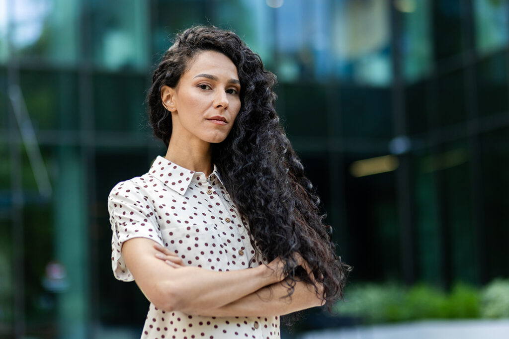 Portrait of confident businesswoman showing a face of determination