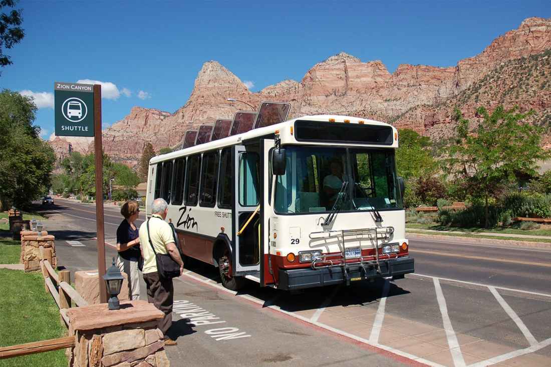 A National Parks Service solar bus picks up passengers.