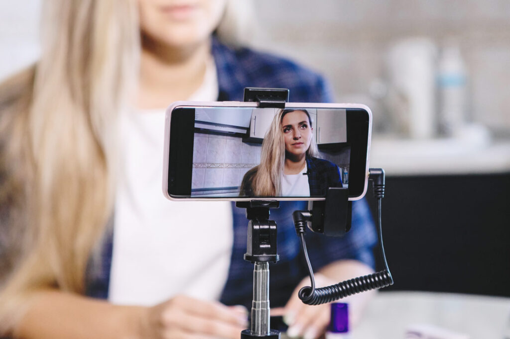 young women recording a video submission for a job interview